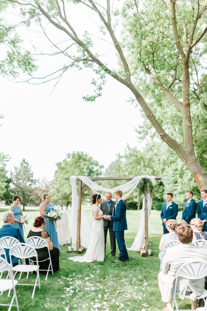 Groom Kissing Real Bride During Social Distancing Wedding Ceremony Outside