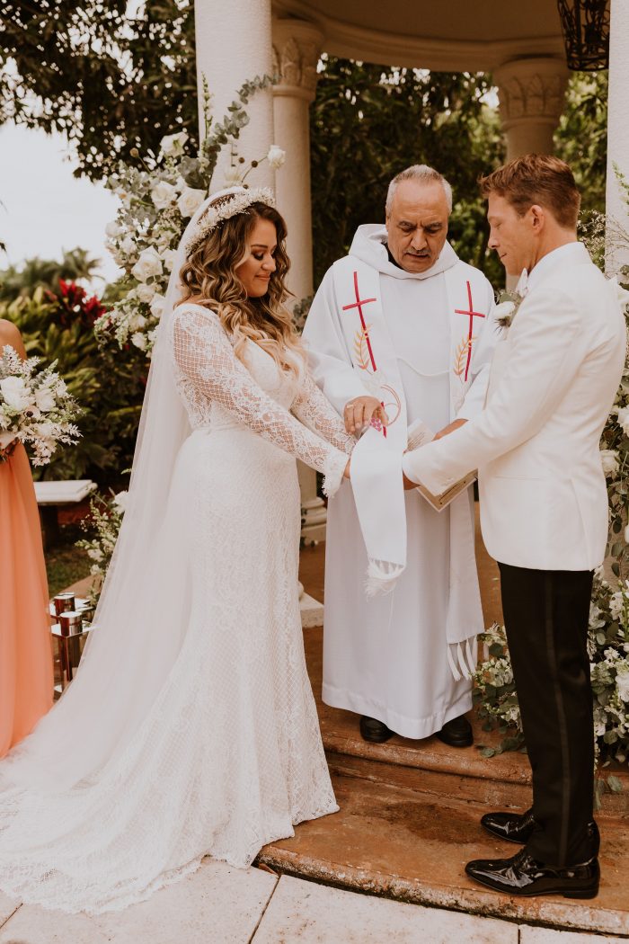 Catholic Priest Blessing Bride and Groom During Catholic Wedding Ceremony