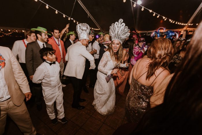 Latin Bride and Groom Dancing Together with Guests at Hora Loca at Multicultural Wedding