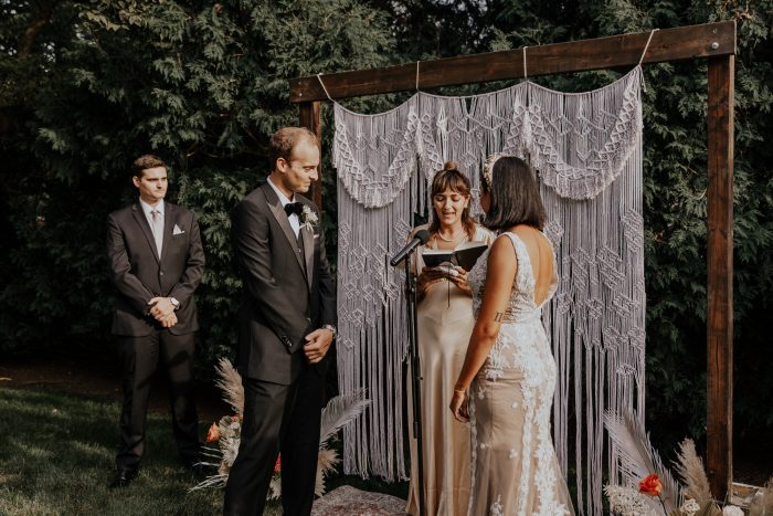 Bride and Groom Saying Vows During Intimate Backyard Elopement