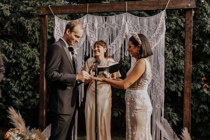 Bride and Groom Saying Vows During Intimate Backyard Elopement