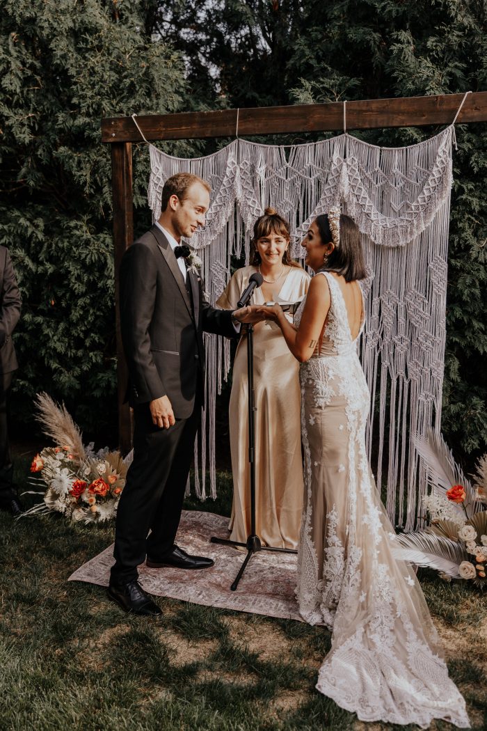 Groom with Real Bride Saying Vows While the Bride's Sister Officiates Wedding Ceremony