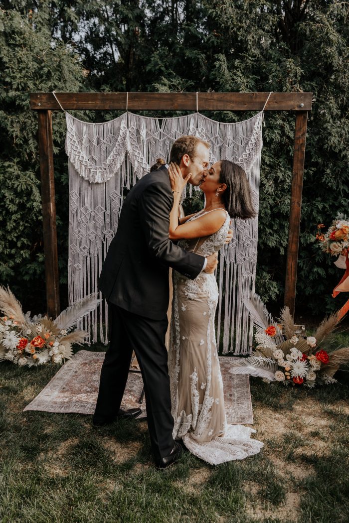 Bride and Groom Kissing After Ceremony at Intimate Backyard Elopement