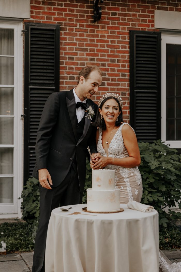 Groom with Real Bride Cutting Wedding Cake at Backyard Elopement