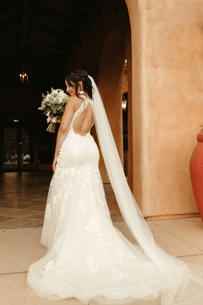 Bride Wearing A Backless Bridal Dress Called Elizabetta By Rebecca Ingram