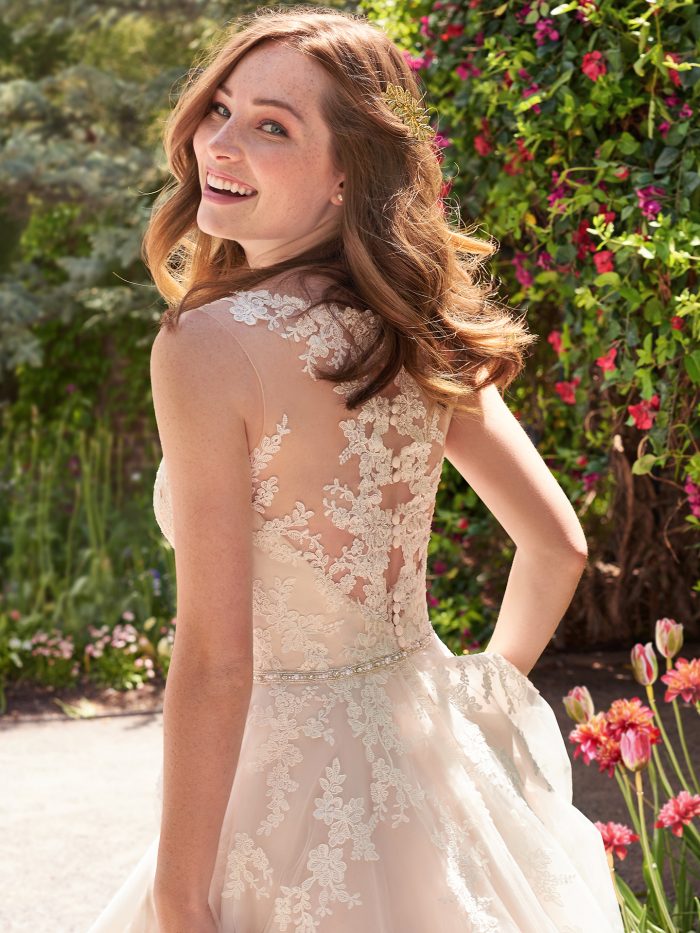 Model Wearing Key Hole Back Short Tea Length Bridal Gown Called Olivia Lane by Maggie Sottero
