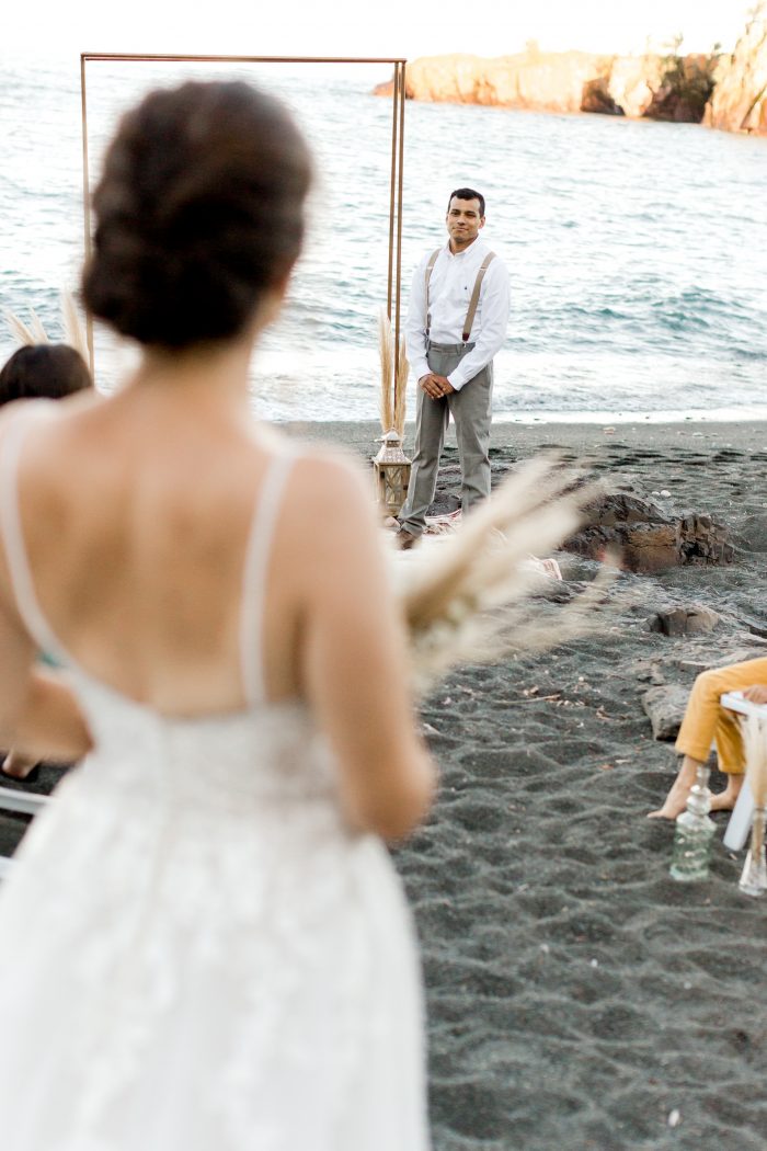 Real Bride Walking Down the Aisle in Boho Beach Wedding Dress by Maggie Sottero Towards Groom at Alter