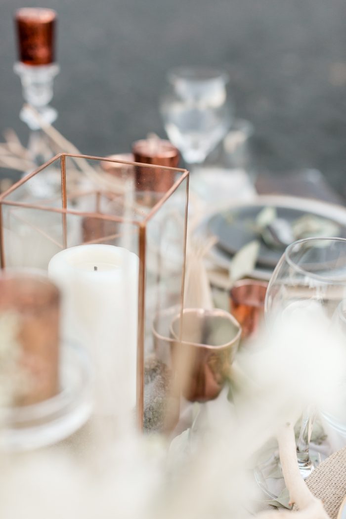 Candles and Glass Ware Featured as Wedding Details at Beach Elopement