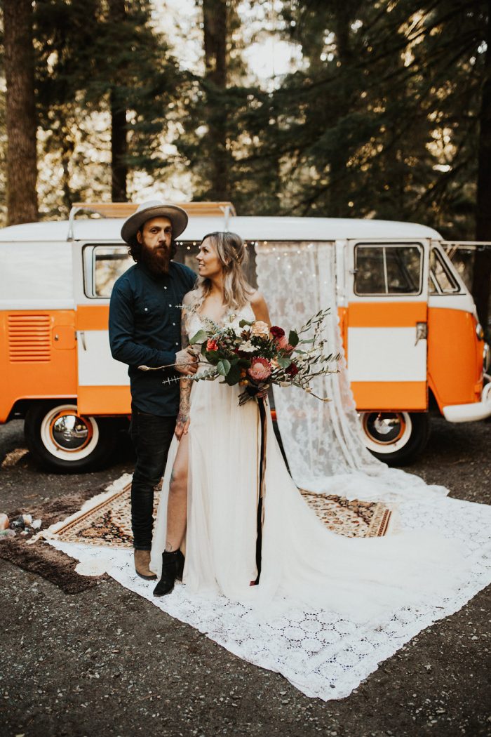 Groom in Front of Hippie Van with Bride Wearing Boho Bridal Gown Called Charlene by Maggie Sottero