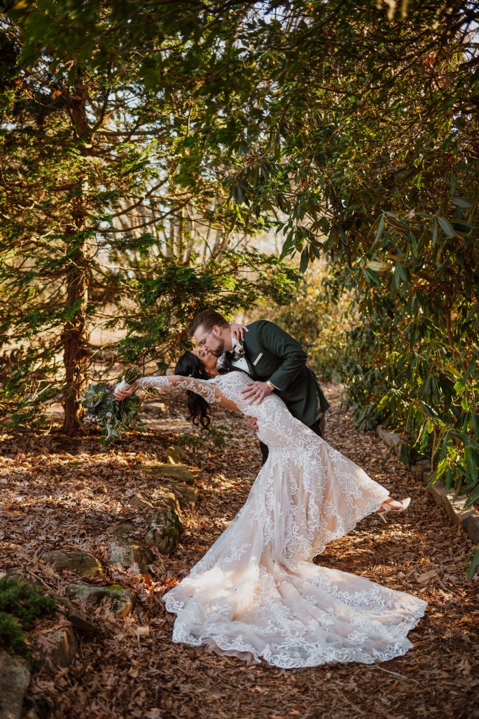 Groom Dipping and Kissing Bride Wearing Illusion Lace Sheath Wedding Gown Called Dakota by Sottero and Midgley