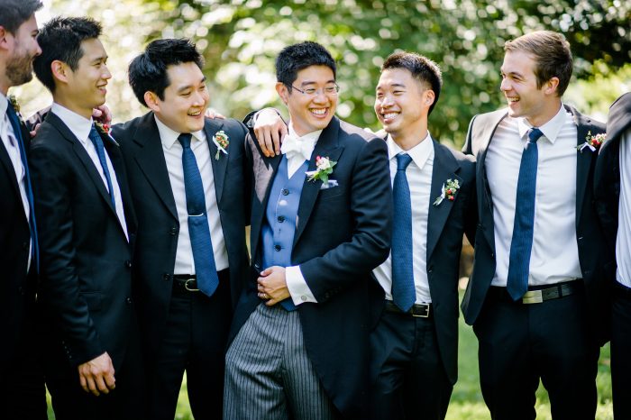 Groom Laughing with Groomsmen