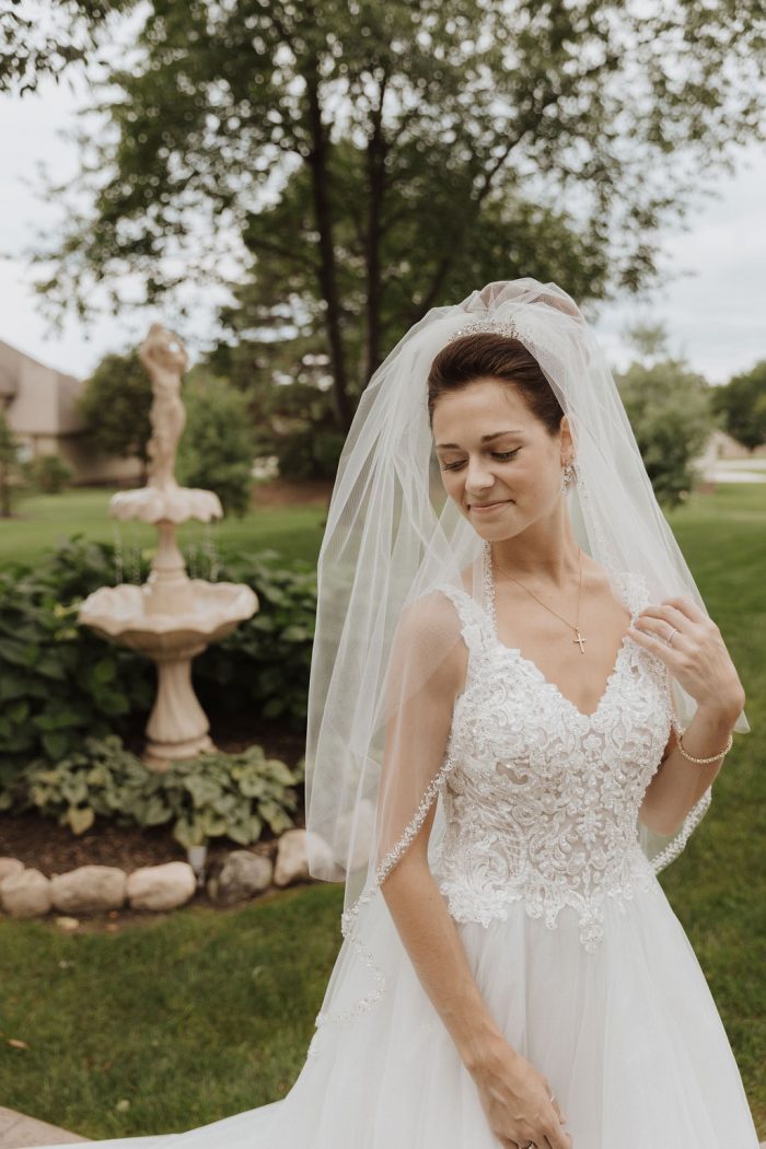Real Bride Wearing Maggie Sottero Ball Gown Wedding Dress Called Taylor Lynette with Elbow Length Wedding Veil