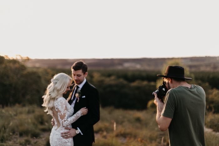 Bride and Groom Being Photographed in the Mountains by Wedding Photographer