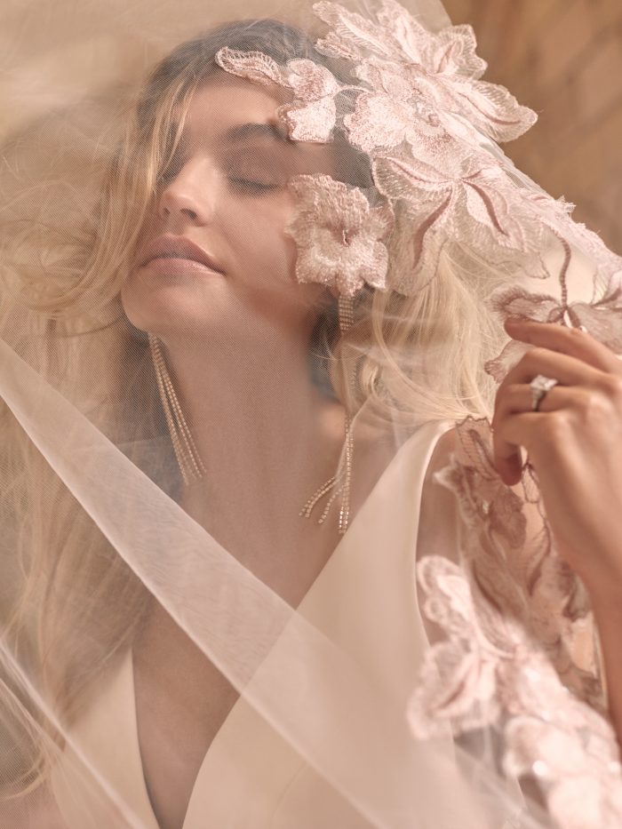 Model Wearing Simple A-line Wedding Dress with Blush Lace Wedding Veil Called Josephine by Maggie Sottero