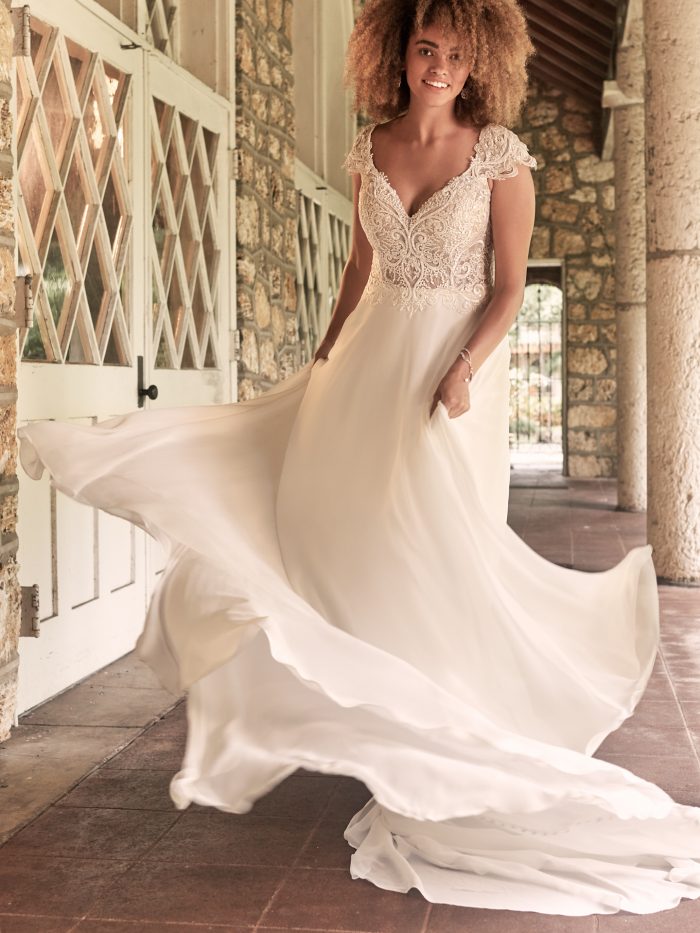 Bride Wearing Boho Cap-Sleeve Chiffon Wedding Gown Called June by Maggie Sottero