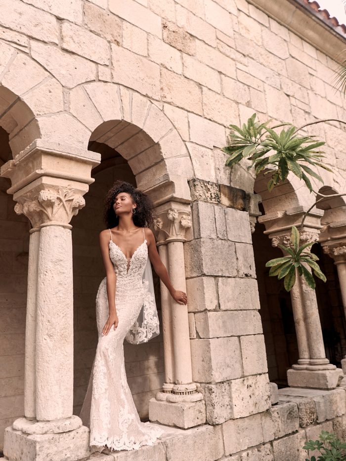 Black Model Wearing Lace Wedding Gown and Fingertip Length Lace Wedding Veil Called Tuscany Royale by Maggie Sottero