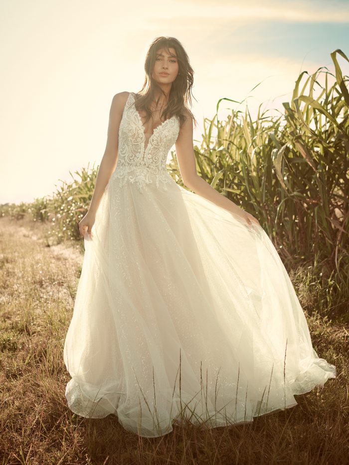 Model Wearing Sparkly Tulle Ball Gown Wedding Dress Called Melissa by Rebecca Ingram