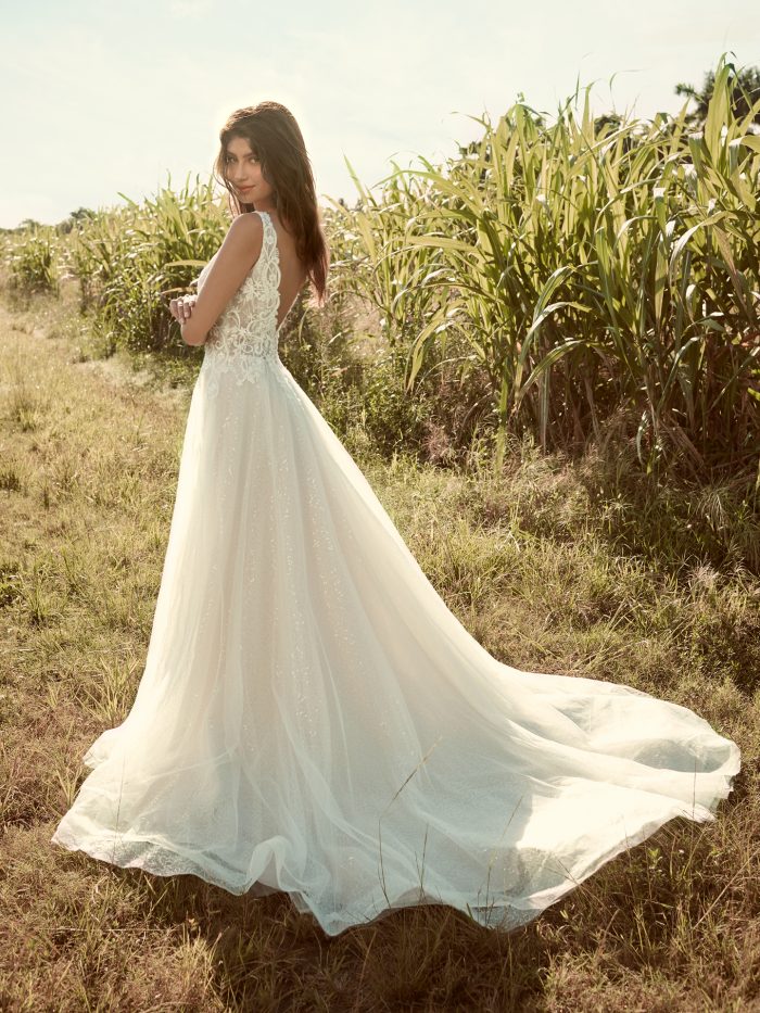 Model Wearing Sparkly Tulle Ball Gown Wedding Dress Called Melissa by Rebecca Ingram