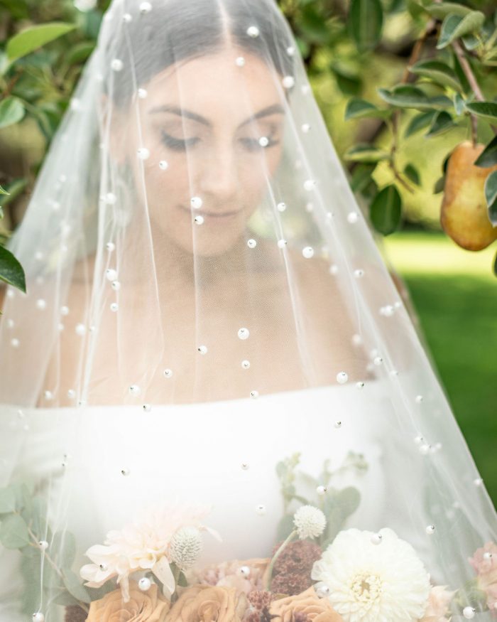 Real Bride Wearing Cathedral Wedding Veil with Pearls Called Pierce by Sottero and Midgley