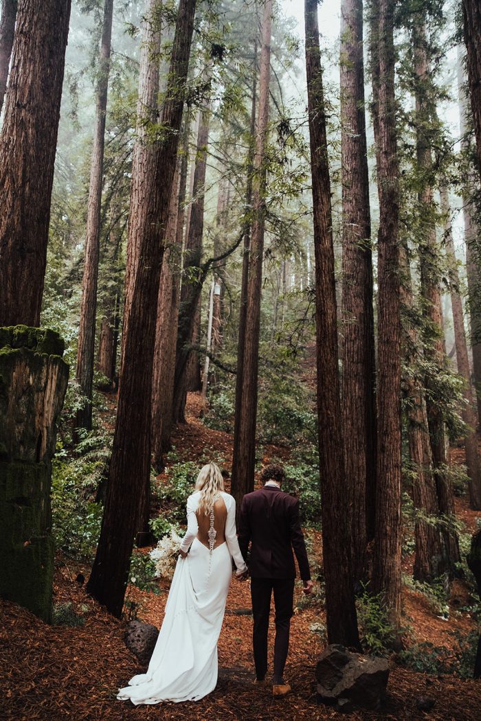 Groom in the Red Woods with Real Bride Wearing Illusion Back Crepe Sheath Wedding Dress Called Arleigh by Sottero and Midgley