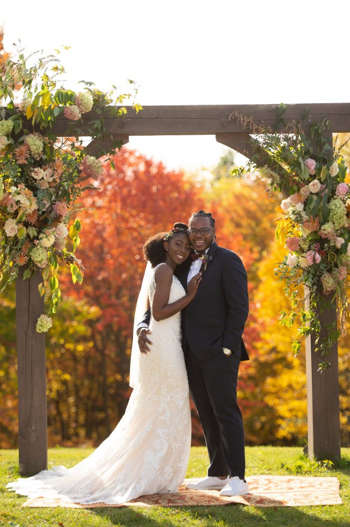 Groom with Real Bride Wearing Lace V-back Wedding Dress Called Winifred by Sottero and Midgley