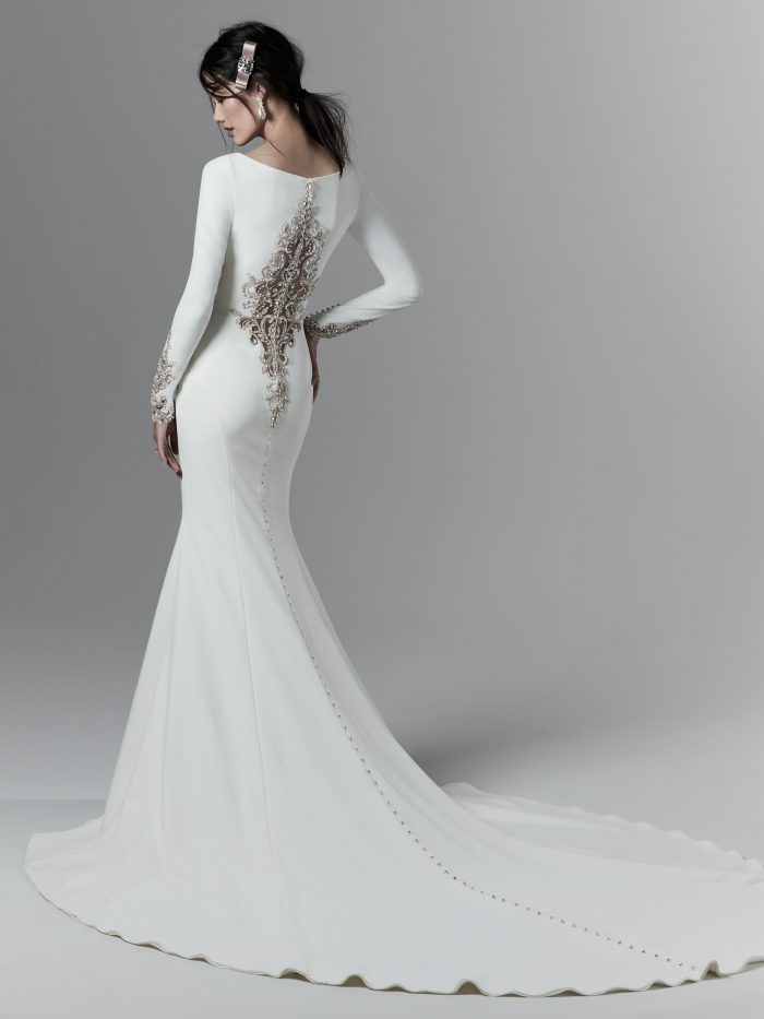 Asian Model Wearing Long Sleeve Crepe Wedding Dress with Embroidered Back Called Aston by Sottero and Midgley