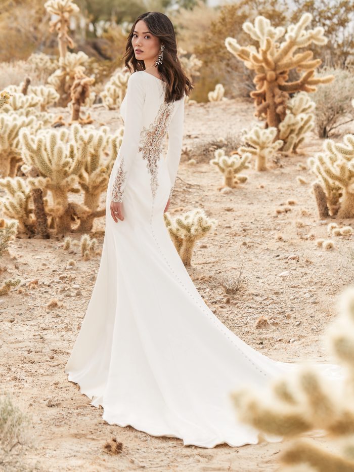 Bride in Dessert Wearing Crepe Long Sleeve Wedding Dress with Beaded Illusion Back Called Aston by Sottero and Midgley