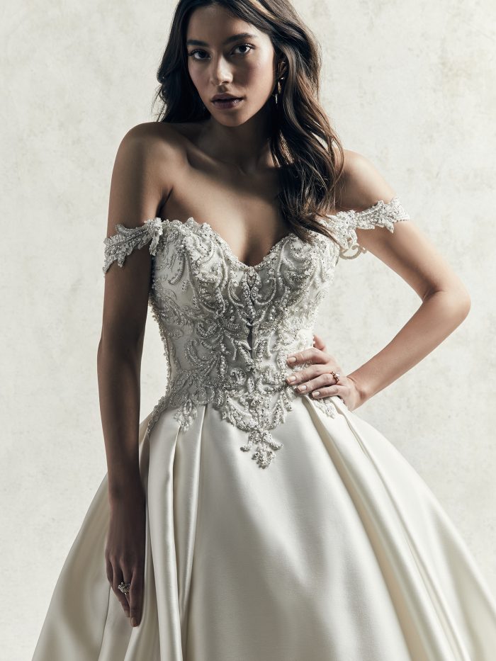 Model Wearing Luxe Satin Ball Gown Wedding Dress with Off-the-Shoulder Sleeves Called Kimora by Sottero and Midgley