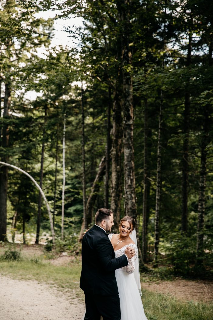 Groom Dancing with Real Bride Wearing Lace Ball Gown Wedding Dress Called Mallory Dawn by Maggie Sottero