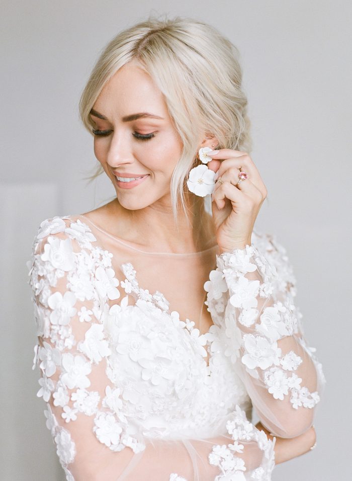Model Ashlee Jensen Wearing Custom Maggie Sottero Wedding Dress with Illusion Lace Floral Bishop Sleeves