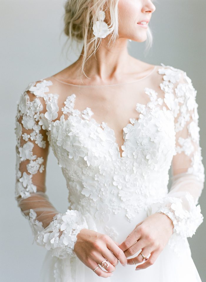 Model Ashlee Jensen Wearing Custom Maggie Sottero Wedding Dress with Illusion Lace Floral Bishop Sleeves