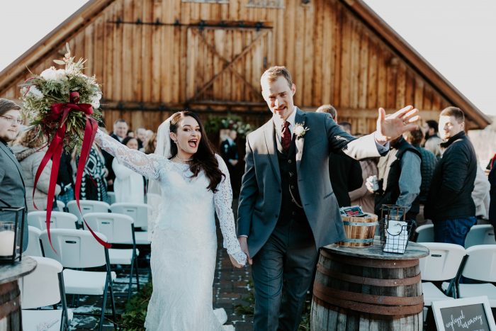 Groom with Real Bride Wearing Sleeved Winter Wedding Dress Called Sabra by Maggie Sottero