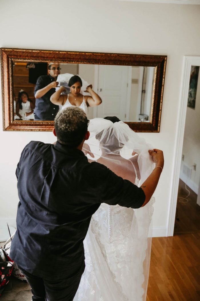 Influencer Aly Q Wearing A Gown By Maggie Sottero Designs Getting Her Veil Fixed