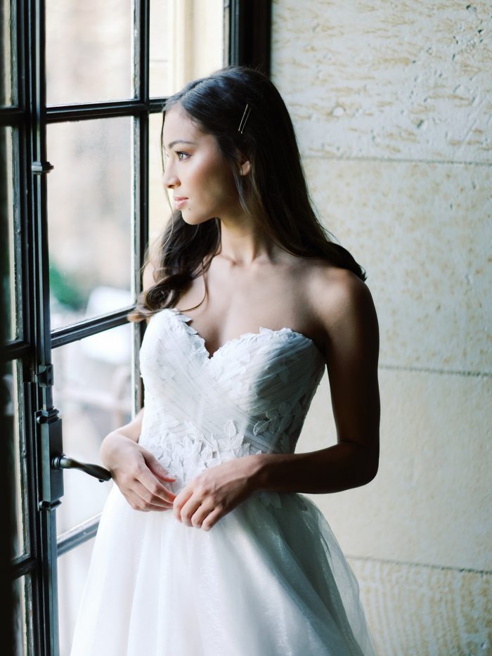 Real Bride Wearing Ruched Floral Wedding Dress Called Remy by Rebecca Ingram