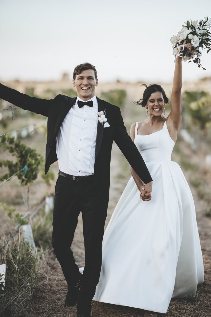 Bride In Satin Wedding Dress With Groom In Tuxedo Called Selena By Maggie Sottero