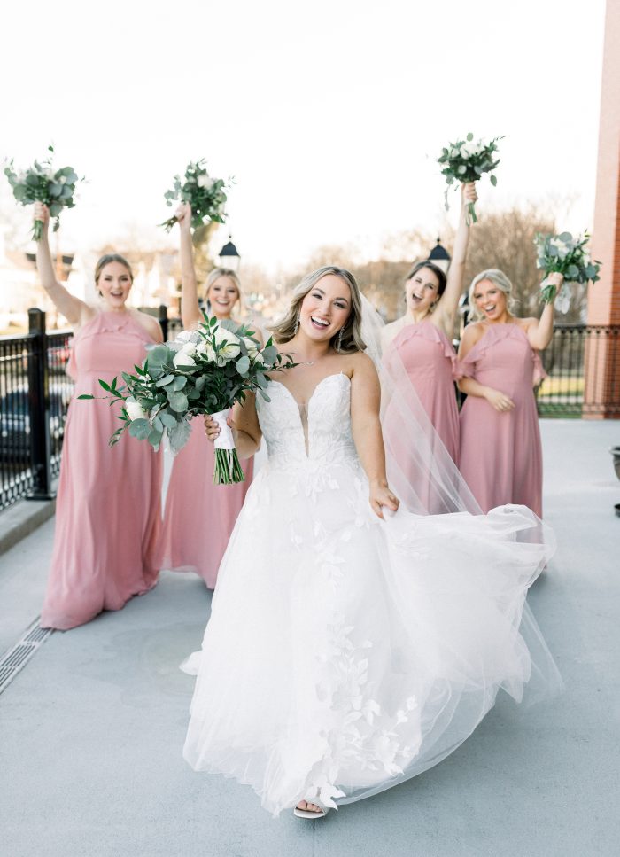 Bride wearing Hattie Lane Marie by Rebecca Ingram with her bridal party