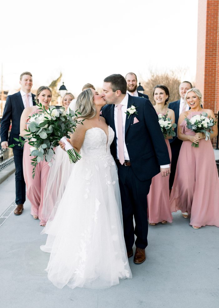 Bride wearing Hattie Lane Marie by Rebecca Ingram with her bridal party