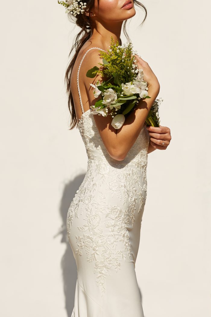 Model wearing simple sheath wedding dress Aubrey by Rebecca Ingram in a Spanish-Inspired Wedding Shoot