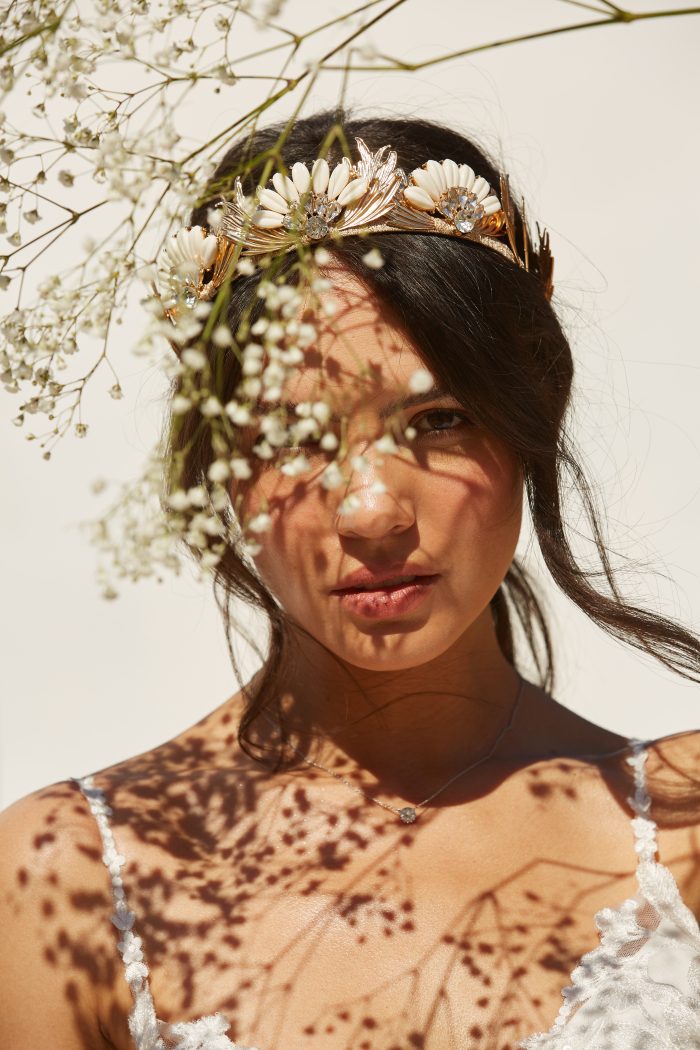 Model wearing lace A-line Wedding Dress Called Ellen by Rebecca Ingram in a Spanish-inspired Wedding Shoot