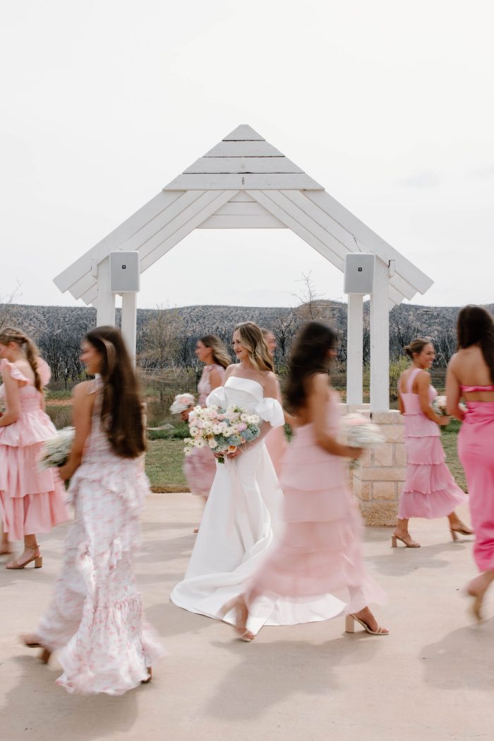 Bride wearing Mitchell by Maggie Sottero with her friends in blush bridesmaid dresses