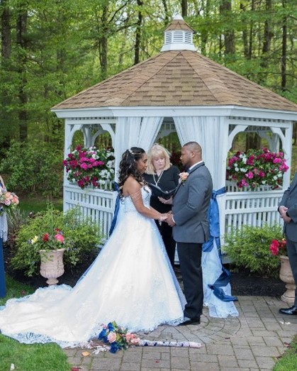 Real Bride and Groom with bride wearing a Maggie Sottero gown in a garden wedding