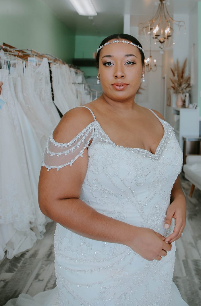 Model wearing Brinkley Lynette Off the Shoulder Wedding Dress by Maggie Sottero