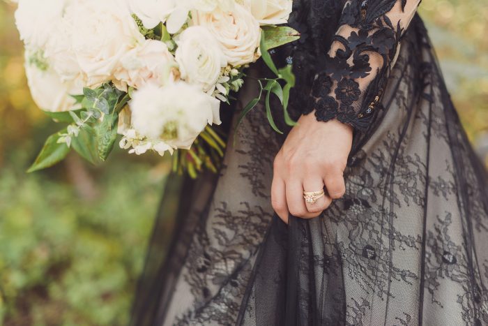 Bride Wearing Black Lace Ball Gown Wedding Dress Called Zander by Sottero and Midgley with White Luxe Bouquet