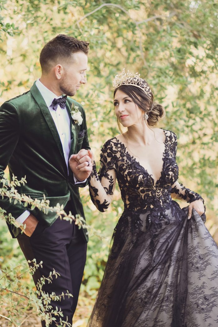 Groom Wearing Green Velvet Tux with Bride Wearing Black Wedding Dress Called Zander by Sottero and Midgley