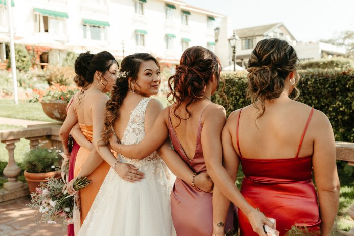 Bride In A-Line Wedding Dress Called Minerva With Bridesmaids In Red