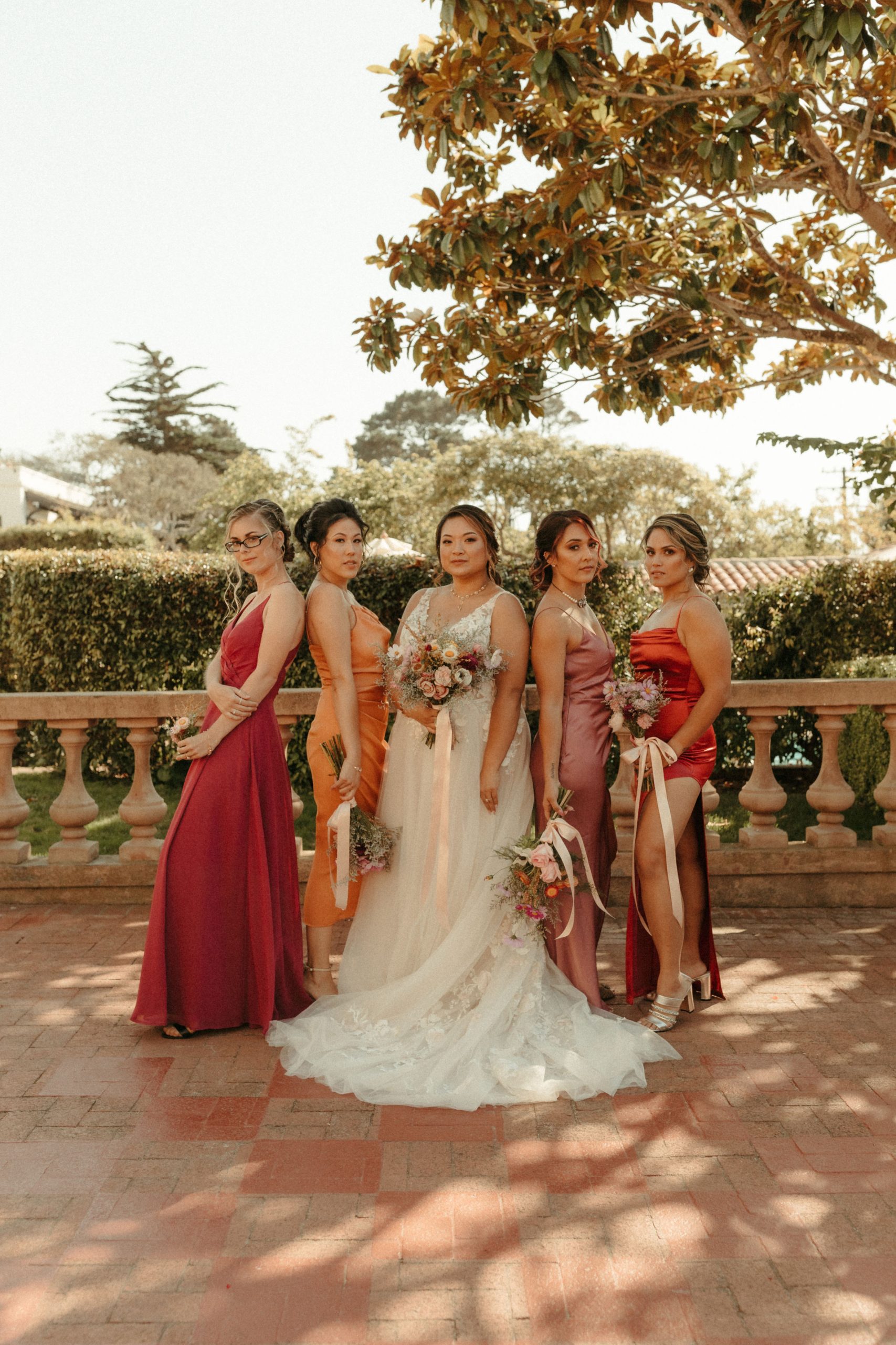 Bride In A-Line Wedding Dress Called Minerva With Bridesmaids In Red