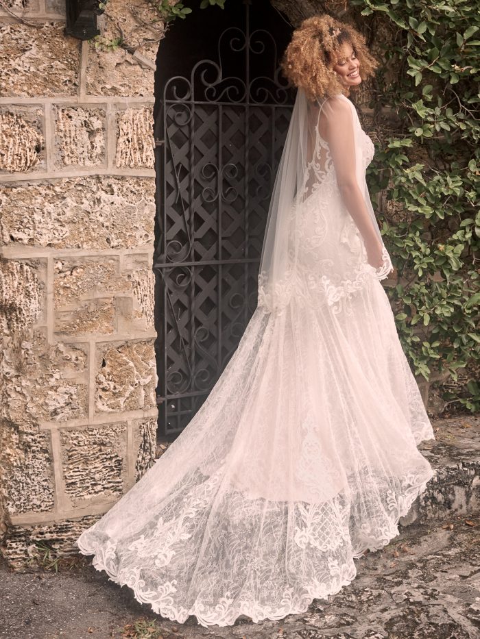 Model wearing Sexy Lace Mermaid Wedding Gown Esther by Maggie Sottero