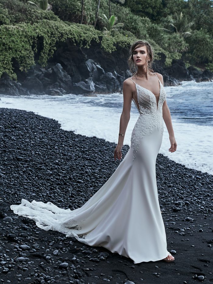 Bride Wearing Crepe Cold Shoulder Wedding Gown Bracken by Sottero and Midgley on the black sand beaches of Hawaii