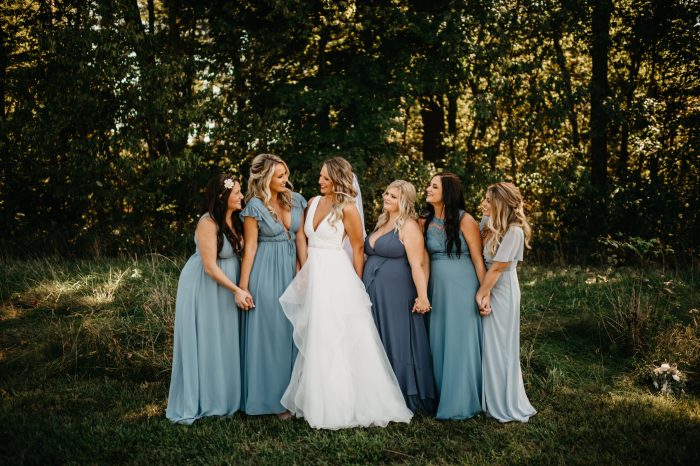 Bride In Ballgown Wedding Dress Called Fatima By Maggie Sottero With Bridesmaids In Blue