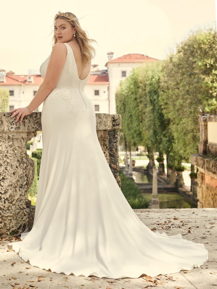 Bride Wearing Crepe Sheath Plus Size Wedding Dress Called Adrianna by Maggie Sottero